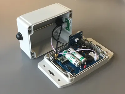 Gray box with distance sensor for measurement water levels